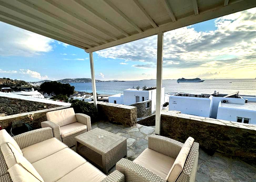 cozy terrace with seating and sea view