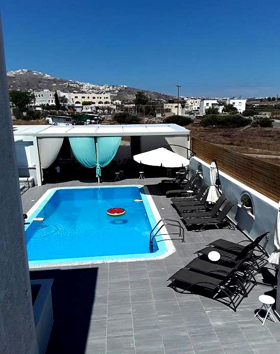 daytime pool view with lounge chairs