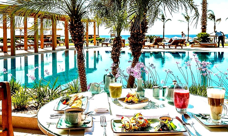 delightful poolside breakfast with sea view and palm trees