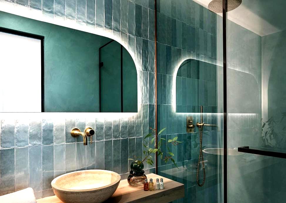 elegant bathroom with glass shower and modern fixtures