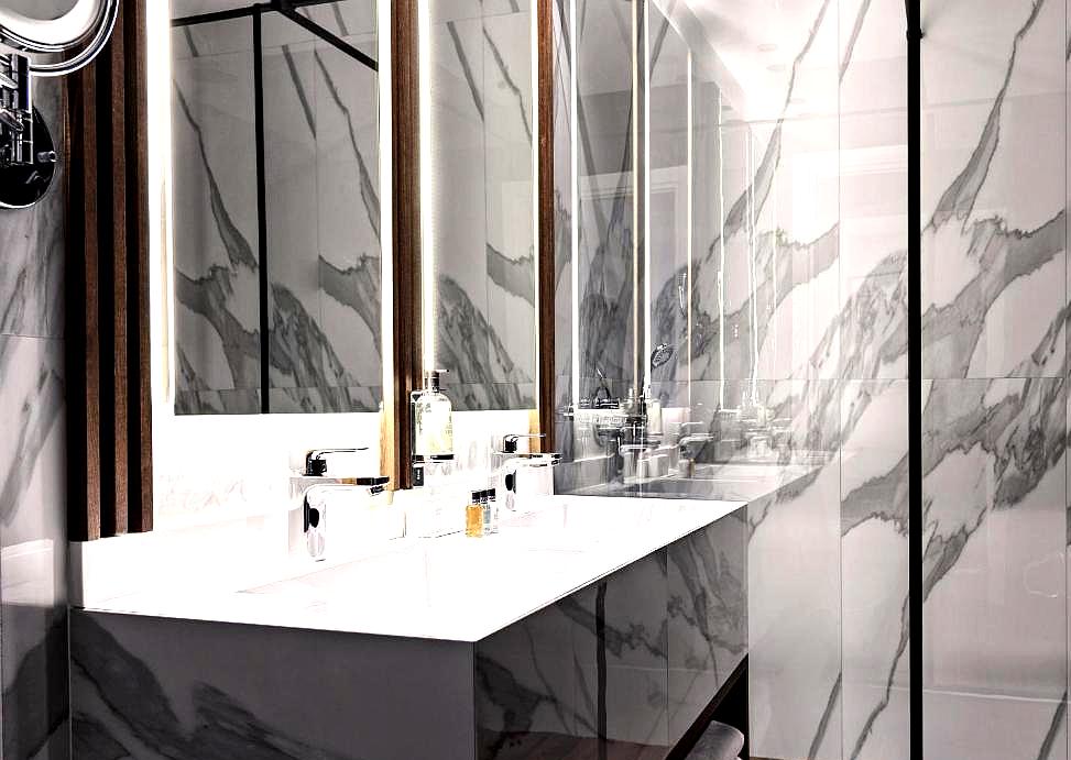 elegant bathroom with marble finishes and double sink