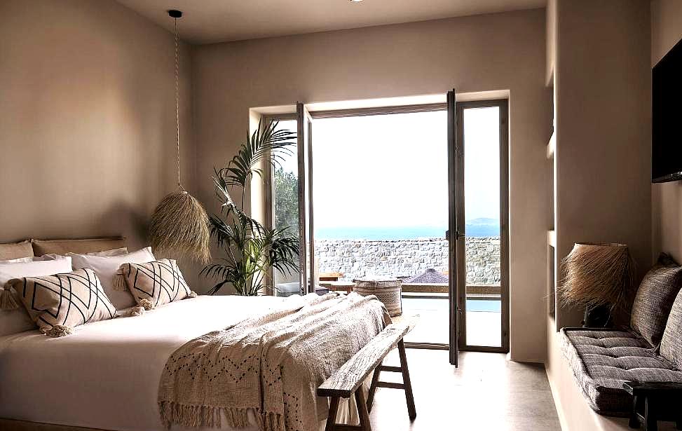 elegant bedroom with pool view and natural light