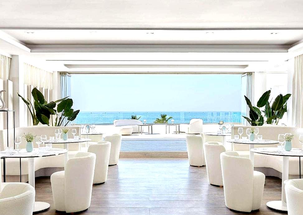 elegant dining room with panoramic sea view and modern decor