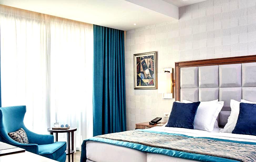 elegant hotel room with blue curtains