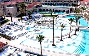 expansive resort pool with sea view