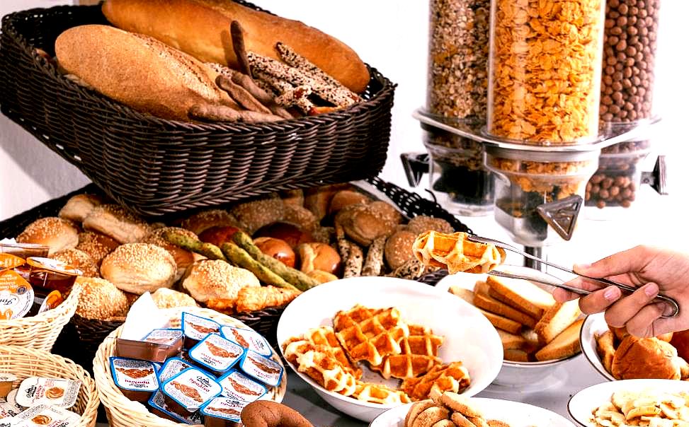 extensive breakfast buffet with fresh bread and cereals