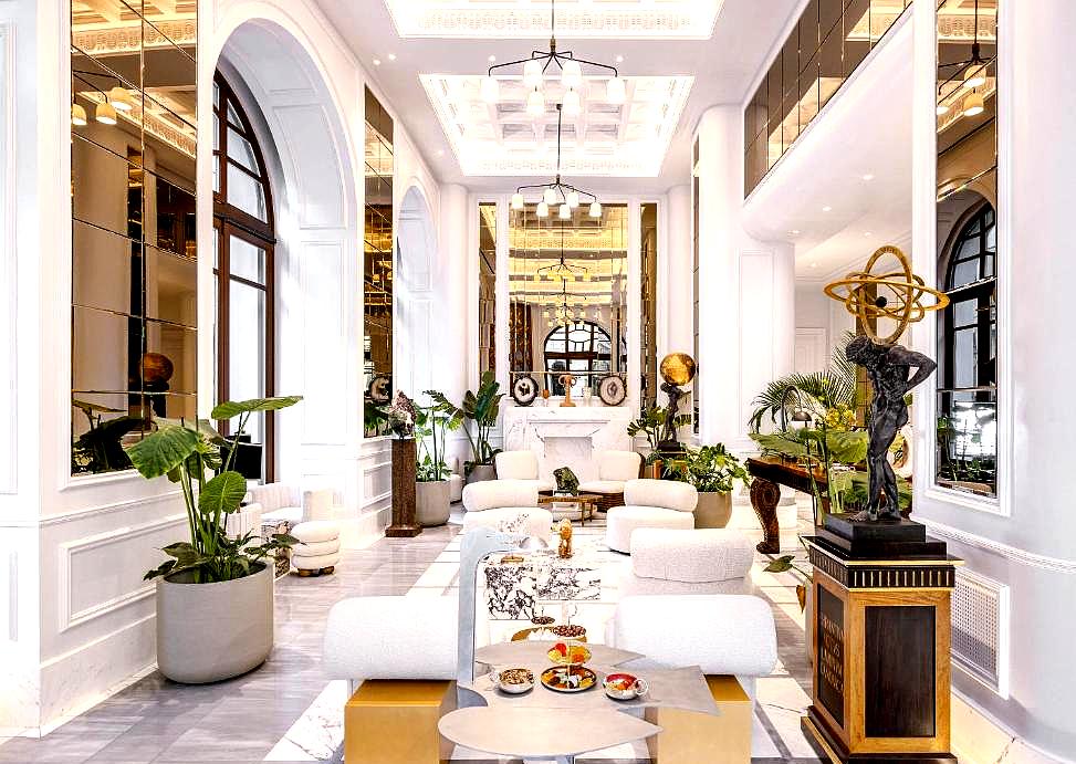 grand lobby with high ceilings modern decor and luxurious seating