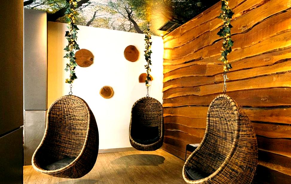 hanging wicker chairs in cozy relaxation area