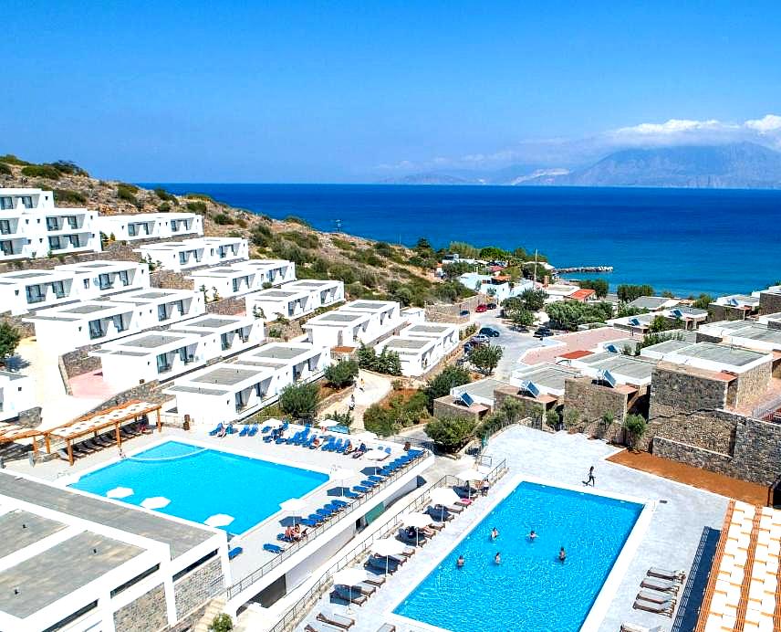 hillside hotel with pools and panoramic sea view