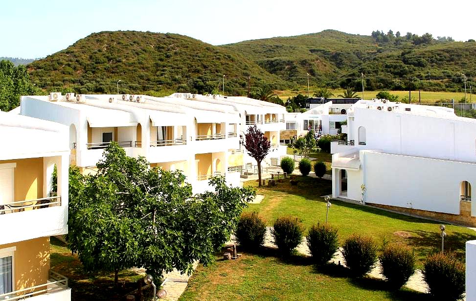 hotel buildings with greenery and hill view