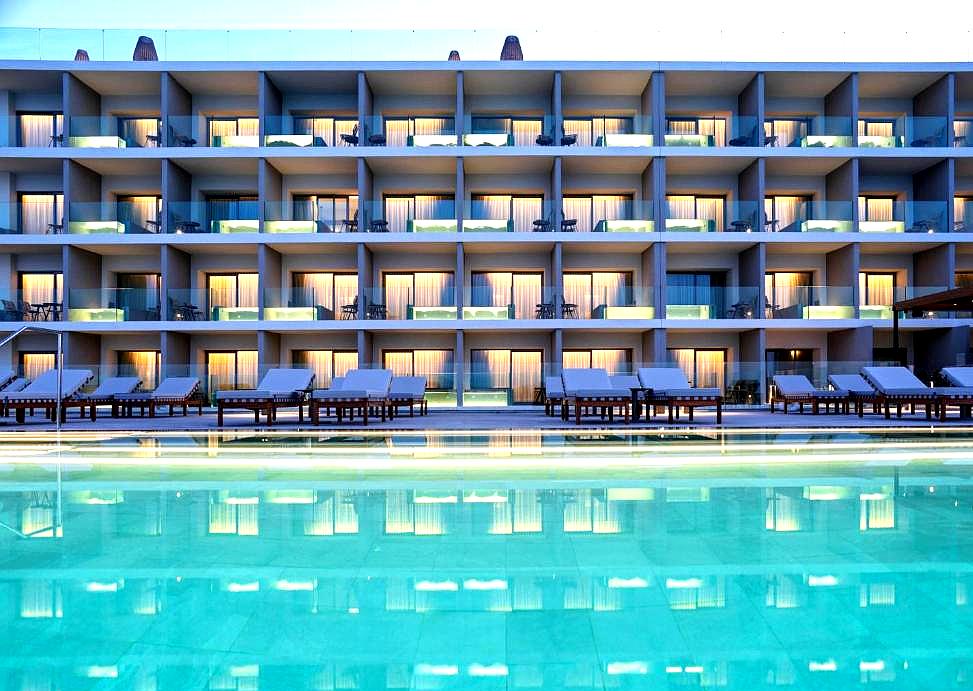 hotel exterior with balconies and pool