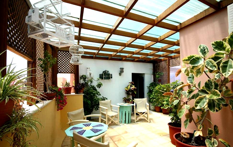 indoor courtyard with potted plants and seating area