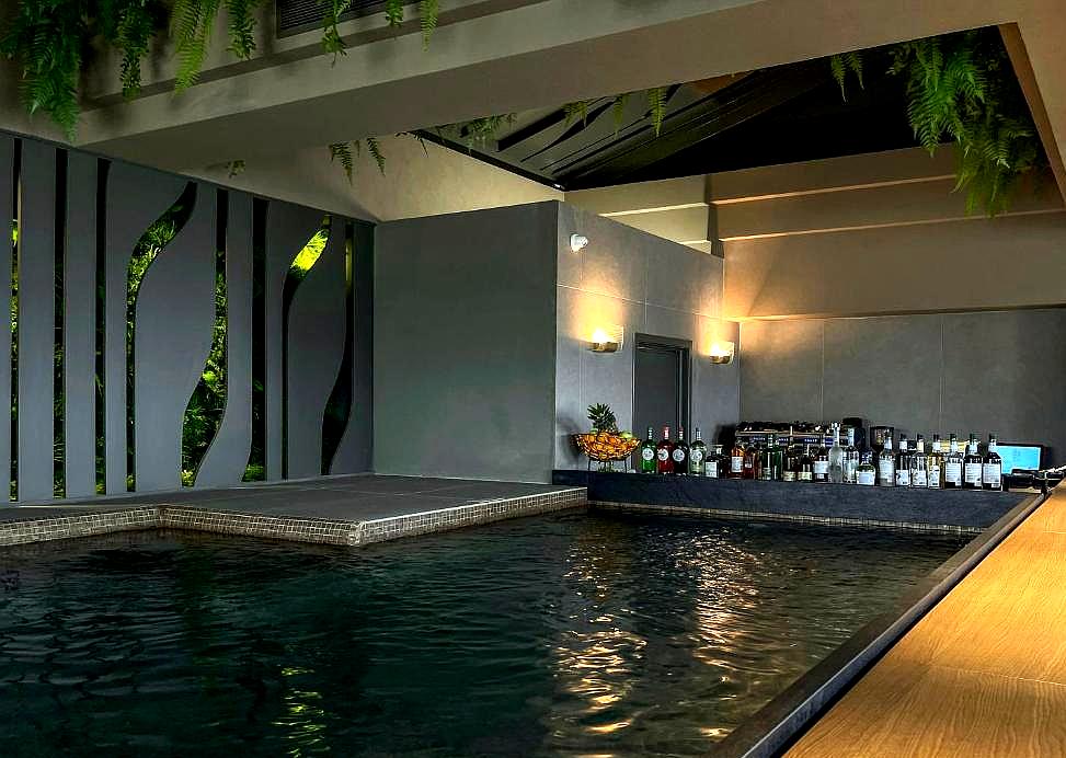 indoor pool with bar and relaxing atmosphere