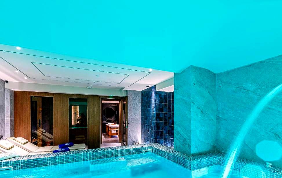 indoor spa pool with waterfall