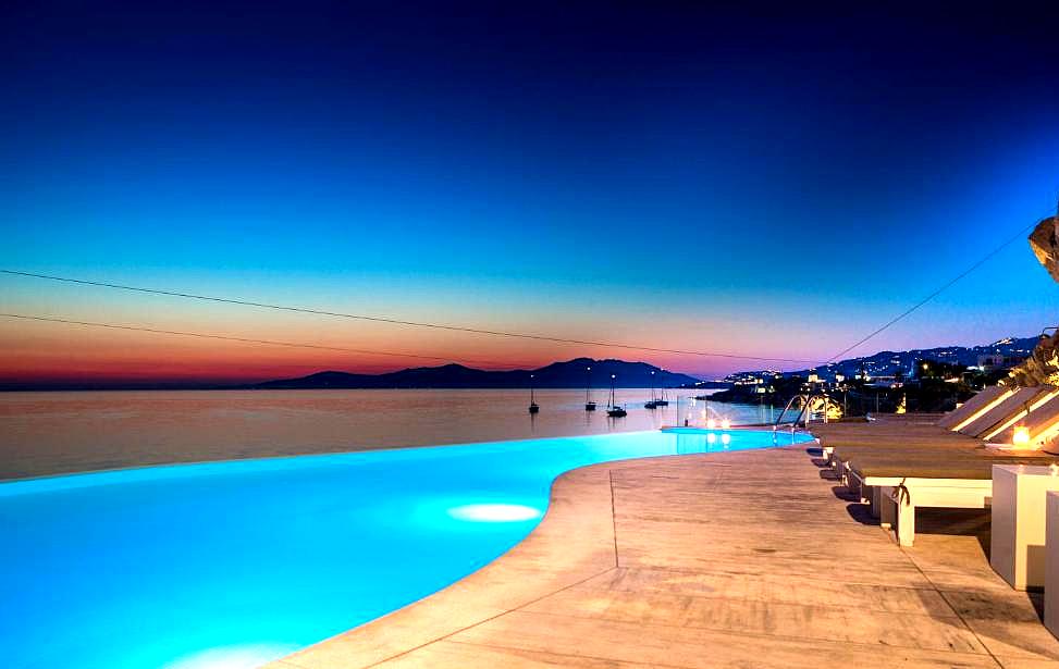 infinity pool overlooking the sea at sunset