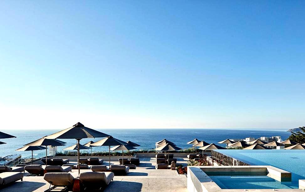 infinity pool with sea view and loungers