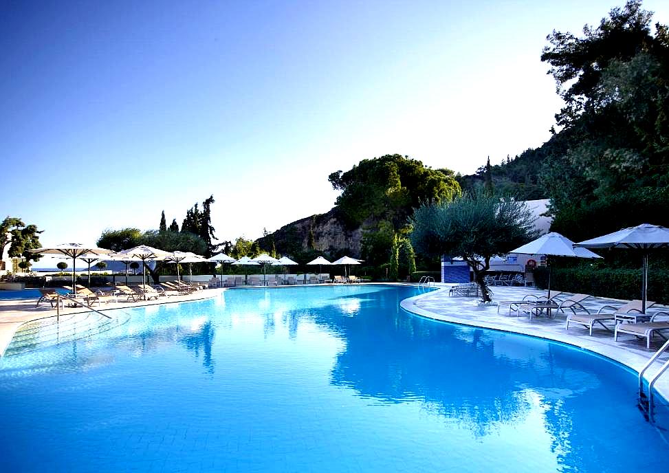 large outdoor pool with sun loungers