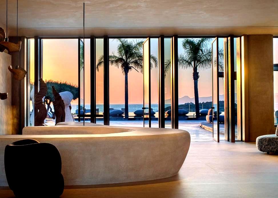 luxurious lobby with modern design and sea view at sunset