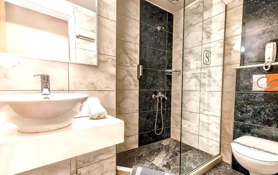 luxurious marble bathroom with glass shower