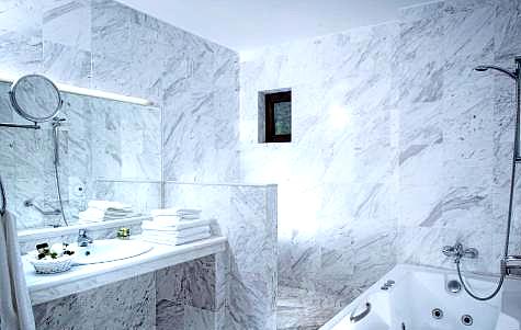 luxurious marble bathroom with jacuzzi