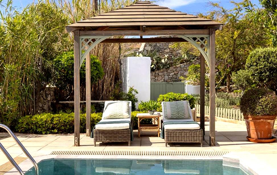 luxury poolside cabana with sun loungers