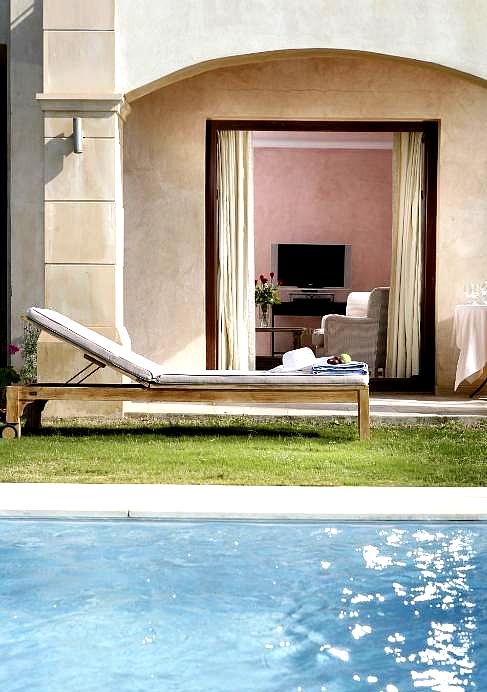 luxury suite with private poolside access and sun lounger