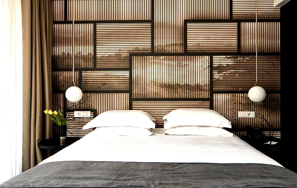 modern bedroom with geometric wall design and soft lighting