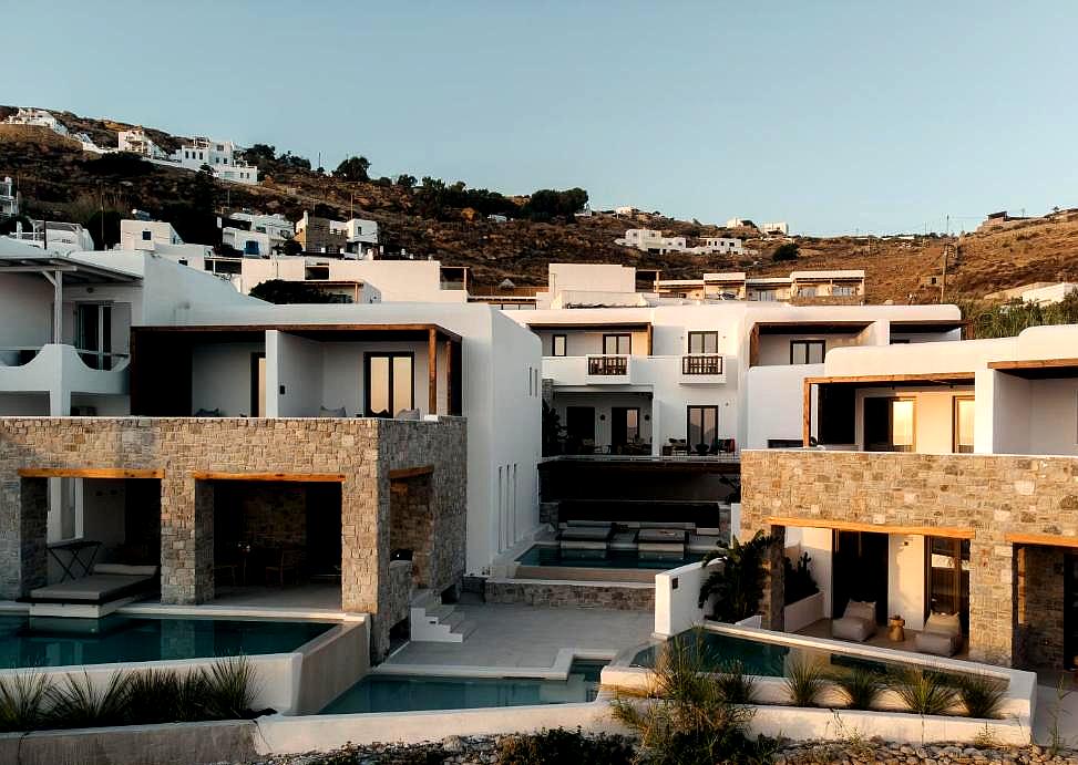 modern hotel exterior with private pools and hilltop view