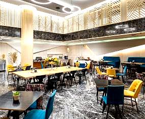 modern hotel restaurant with bright seating and marble flooring