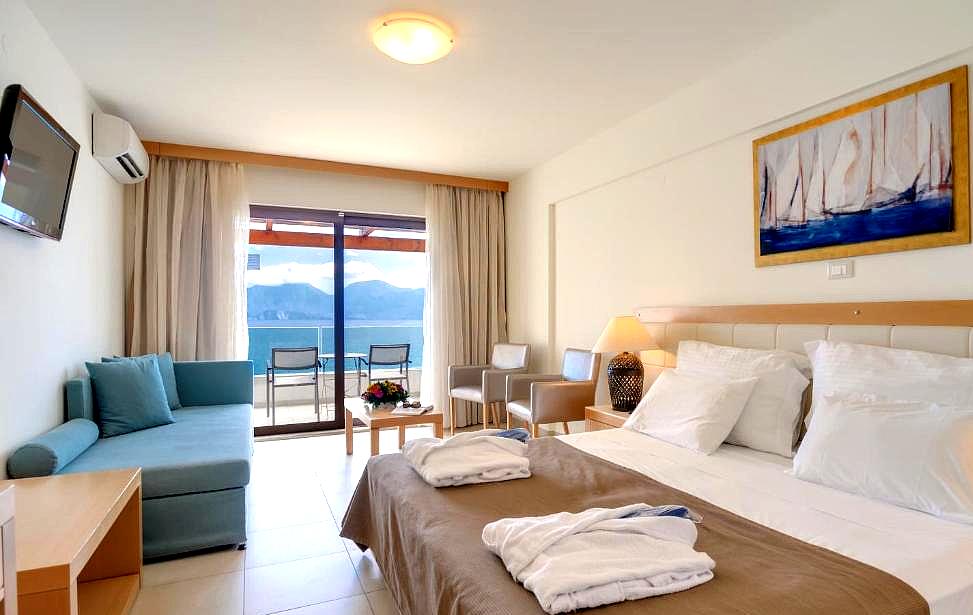 modern hotel room with balcony and sea view