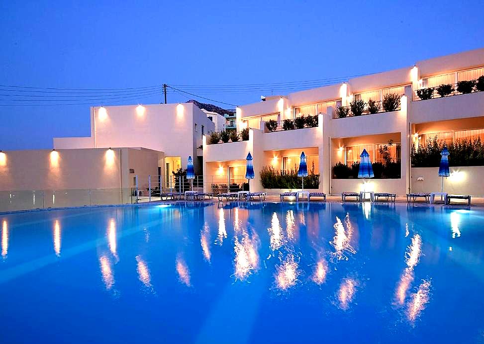 modern hotel with large pool and evening ambiance