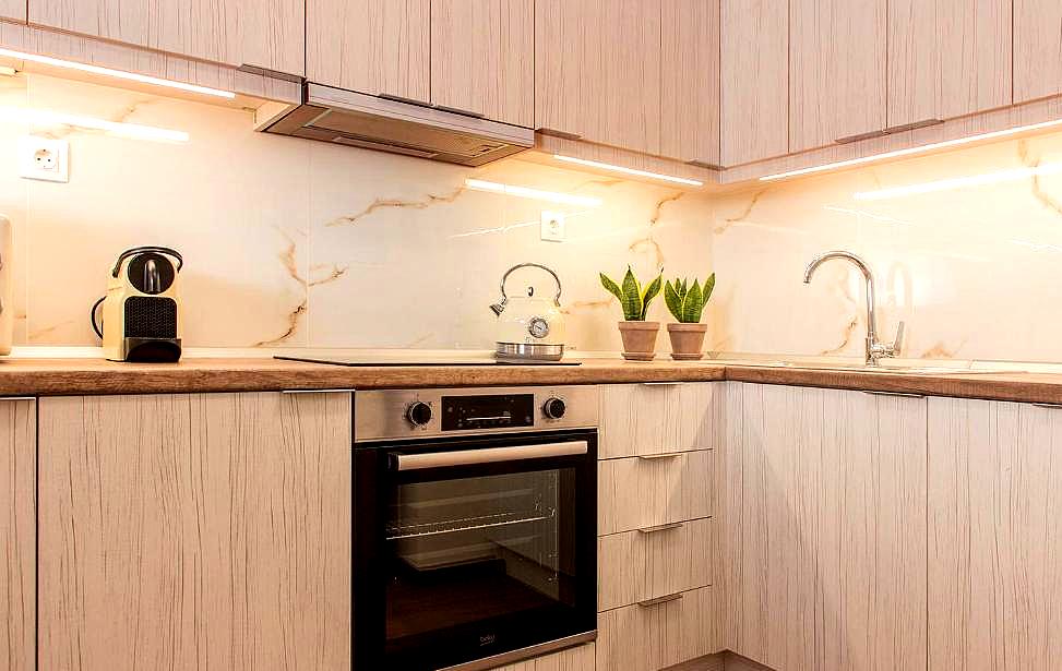 modern kitchenette with marble backsplash