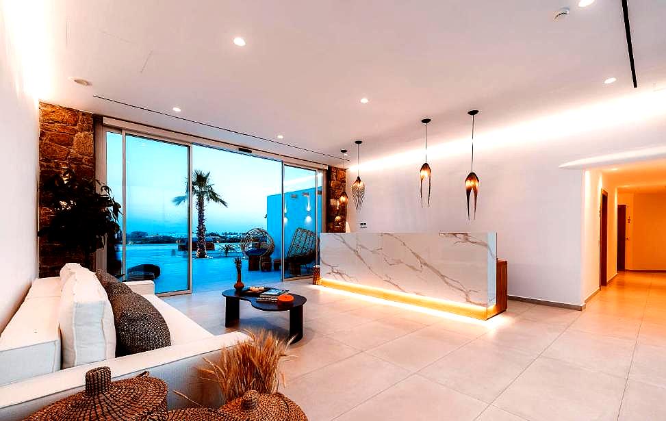 modern lobby with sea view and illuminated reception desk