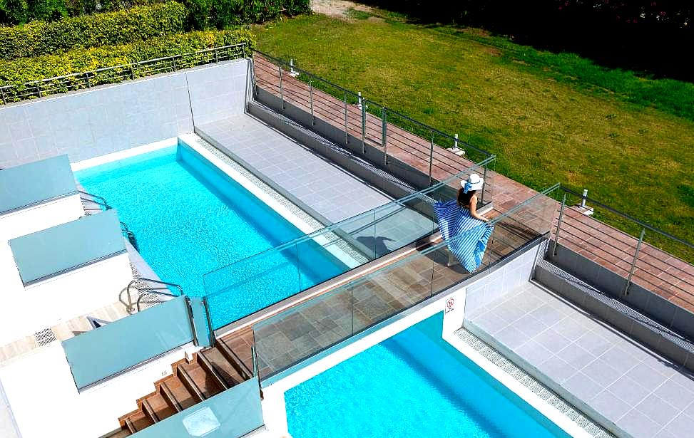 modern pool with elevated walkway