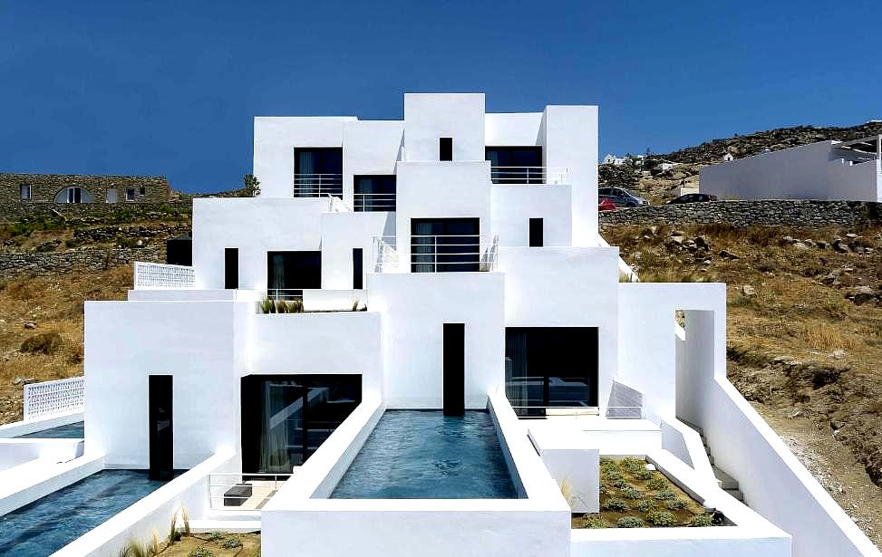 modern white exterior with private pools