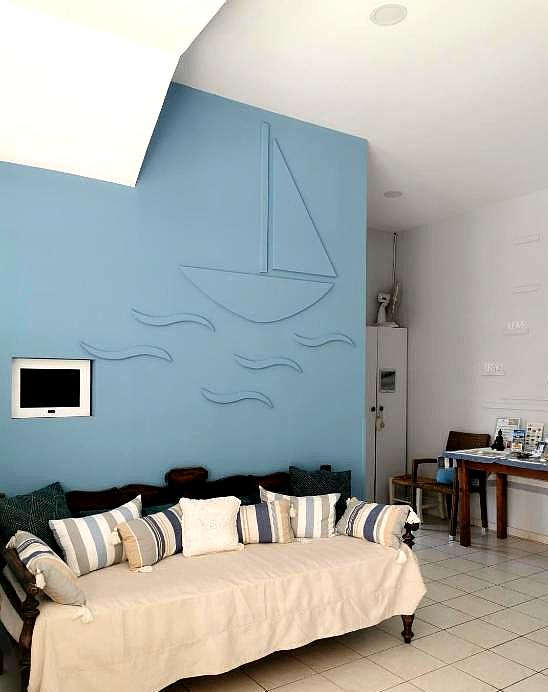 nautical themed lounge area with blue walls