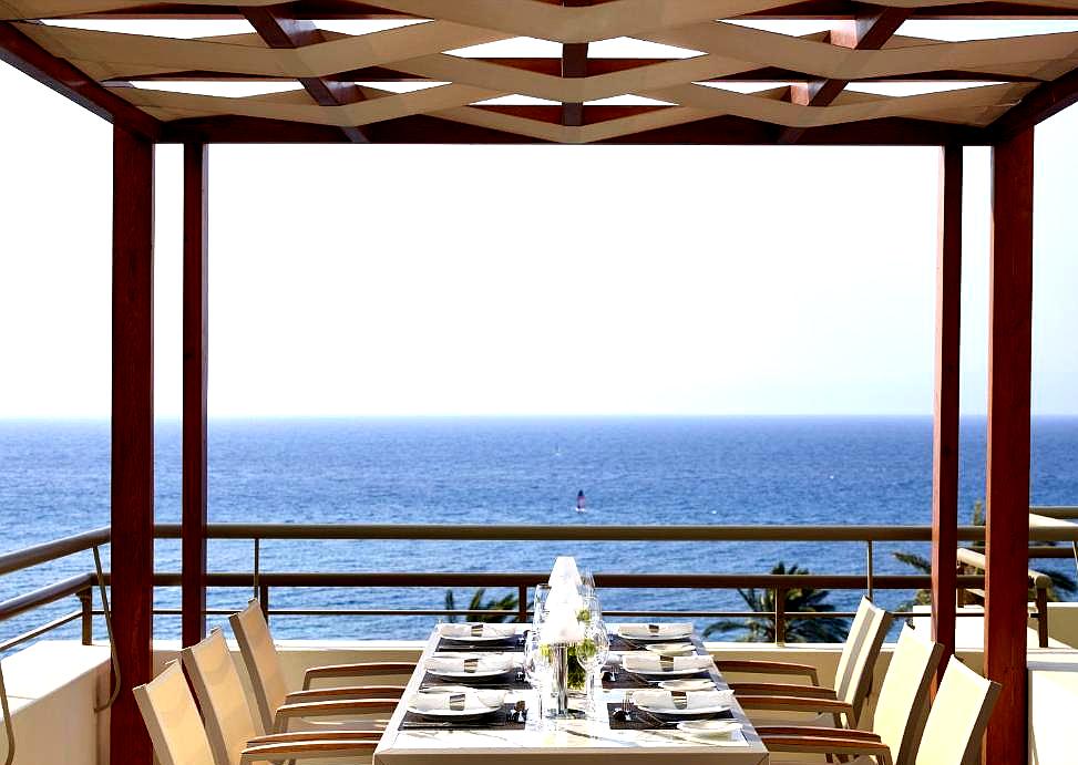 outdoor dining area with sea view