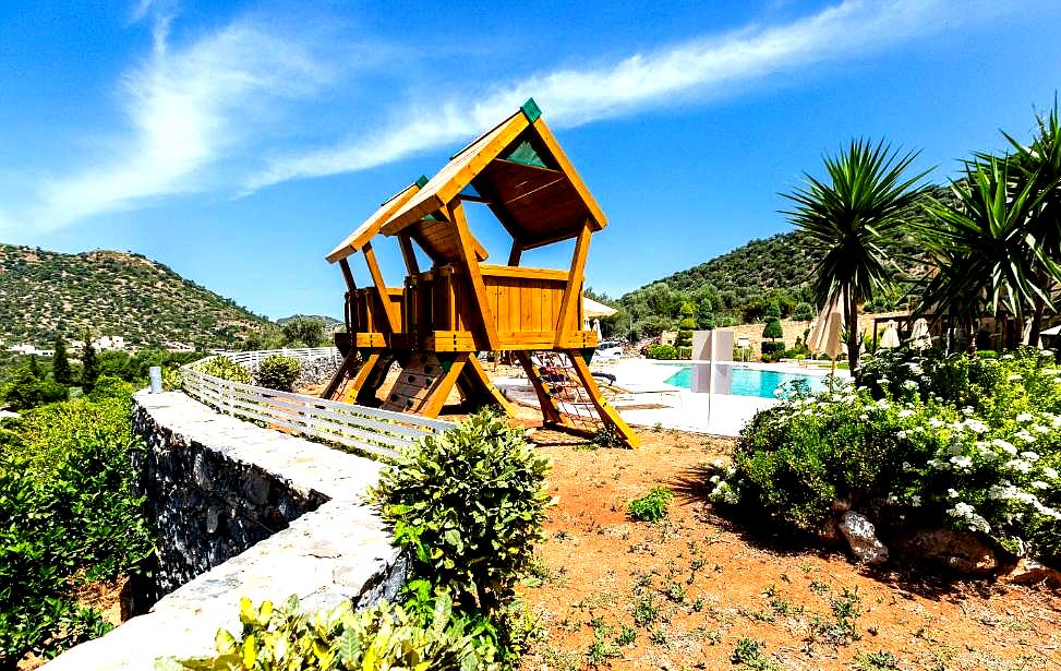 outdoor play area with mountain views and poolside