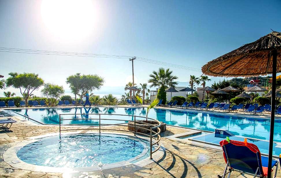 outdoor pool area with jacuzzi and sea view