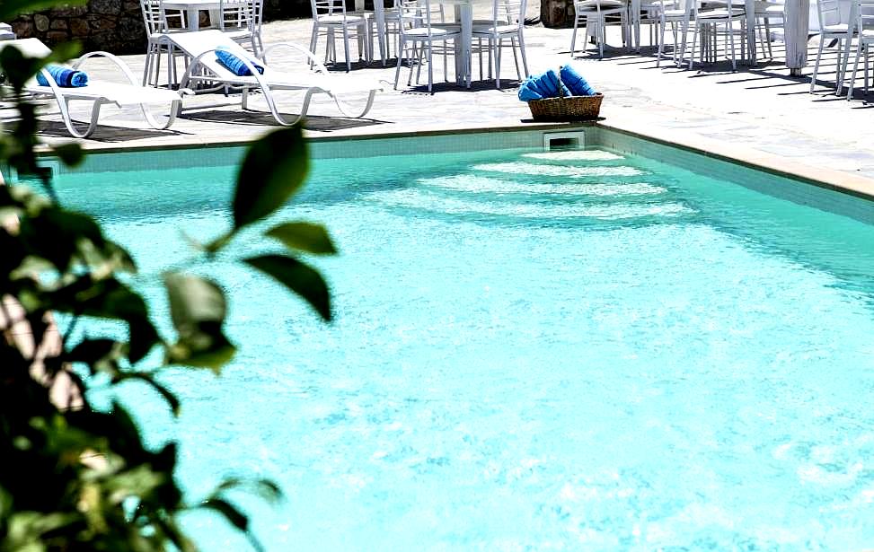 outdoor pool with lounge chairs