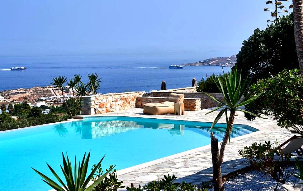 outdoor pool with sea view and landscaped garden