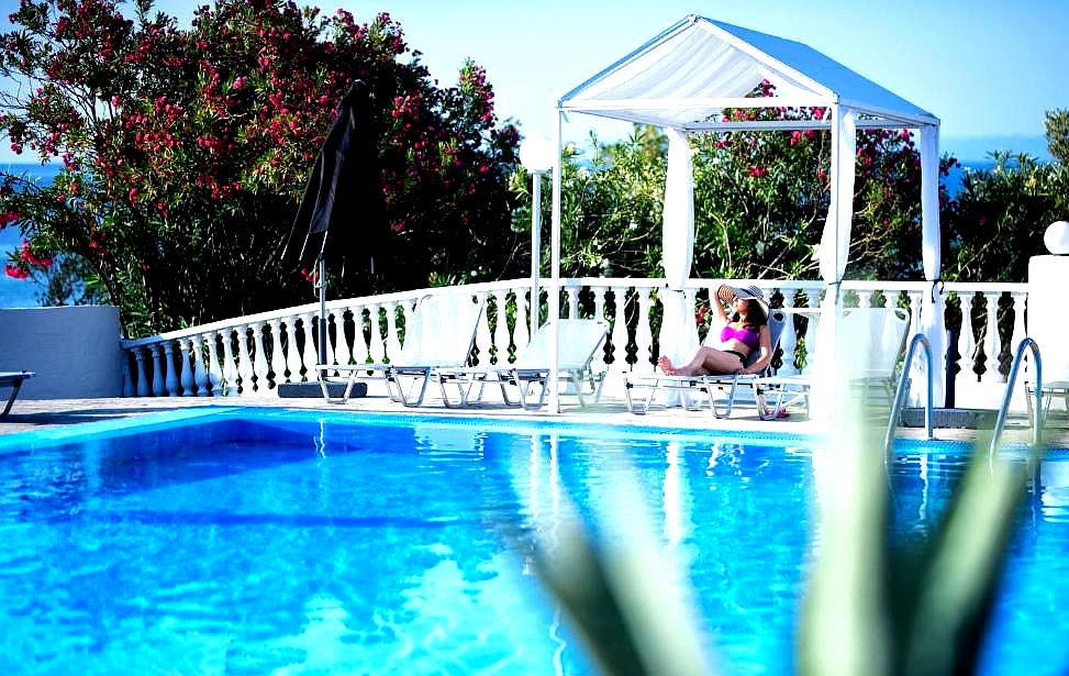 outdoor poolside cabana with sea view