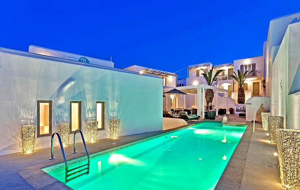 outdoor swimming pool at night with glowing lights