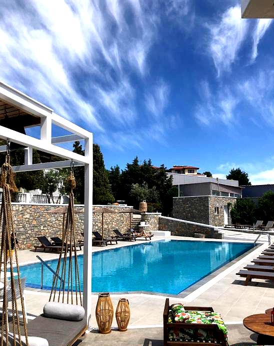 outdoor swimming pool with sun loungers