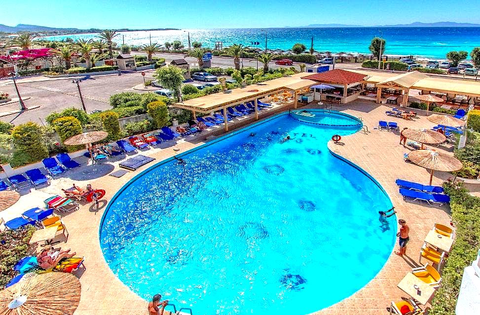 pool area with sea view and sun loungers