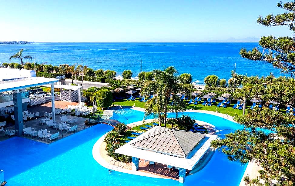 poolside area with sea view and sun loungers