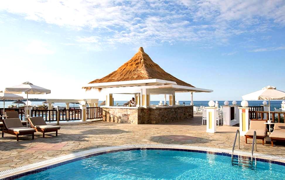 poolside bar with sea view and loungers