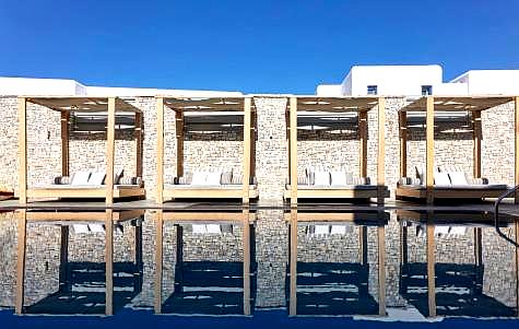 poolside cabanas reflecting on water