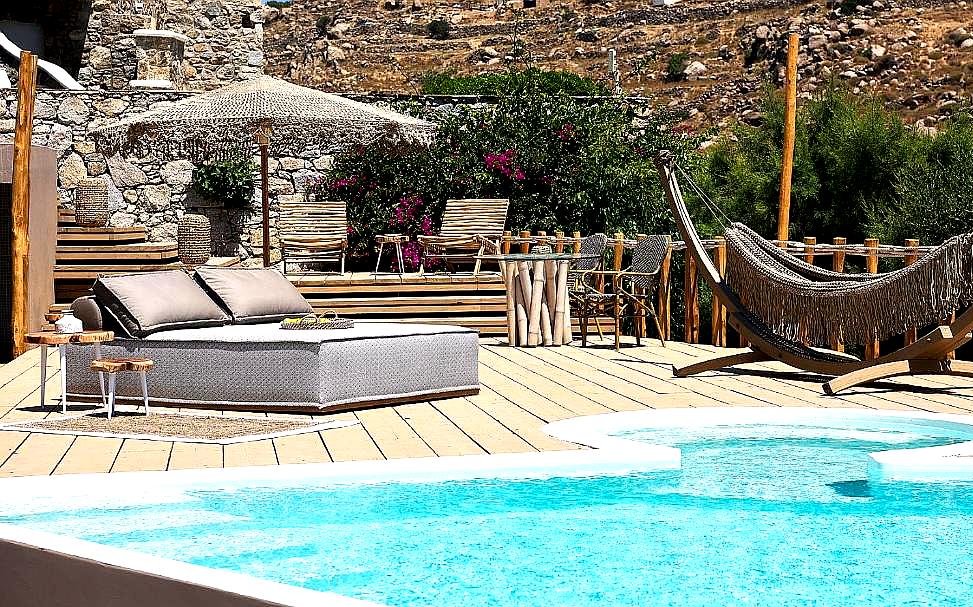 poolside lounge area with hammock and cabanas