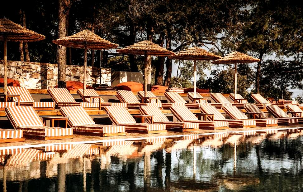 poolside loungers with shade umbrellas